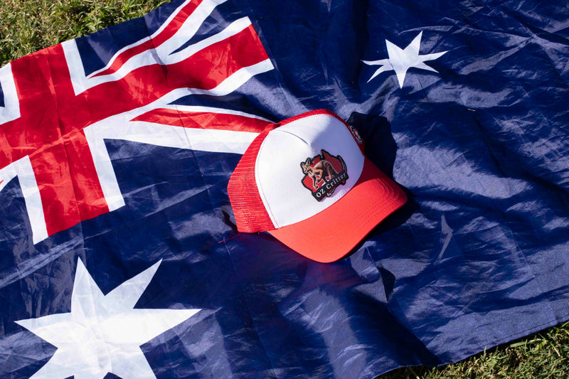 Red and white kangarro cap with OZ Critter logo on an Australian flag